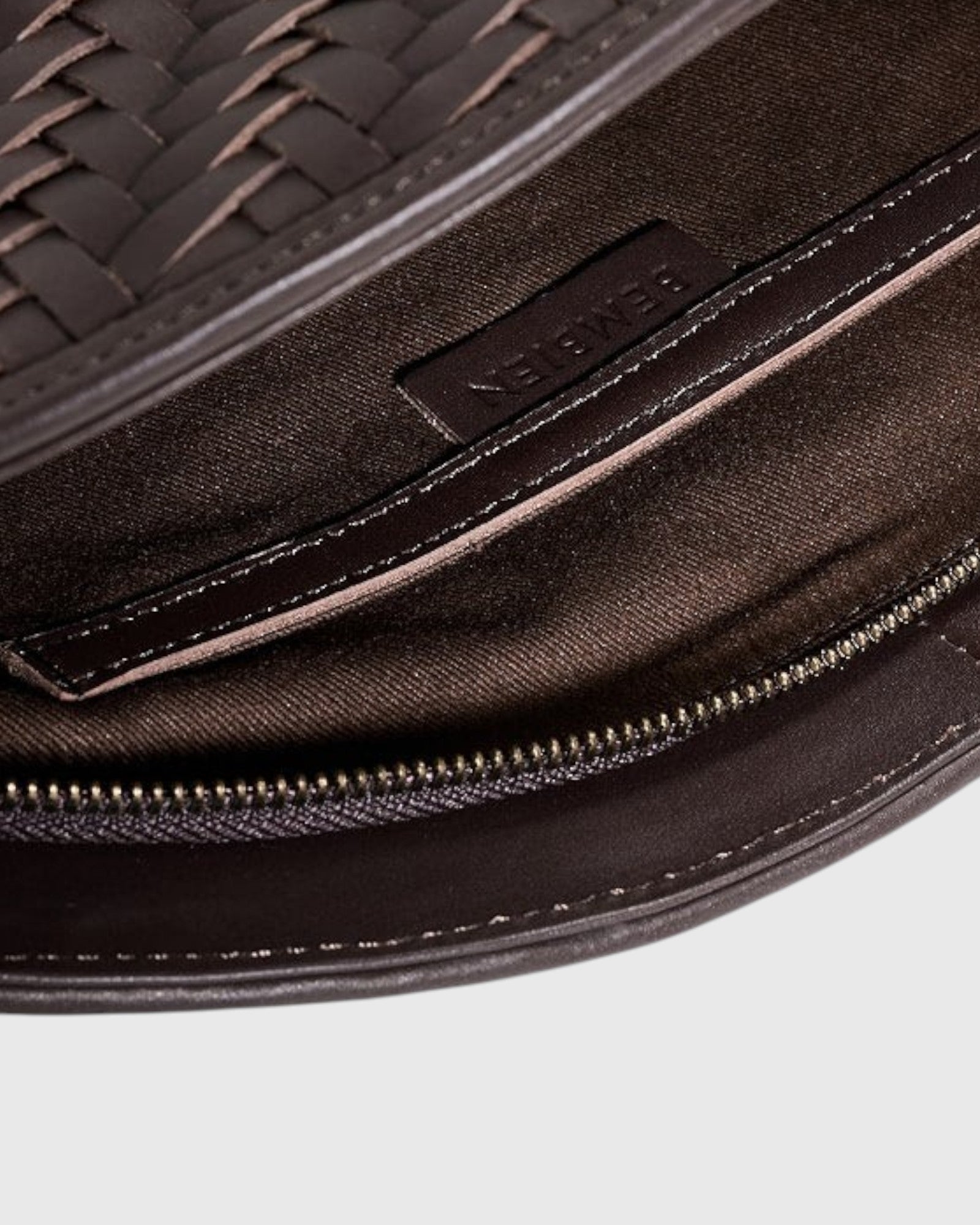 JONES + CO Elin Pouch in espresso brown braided calfskin with a zip closure and interior card slot detail