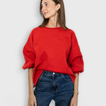 JONES + CO Rachel Comey Fond cherry red crewneck sweatshirt with drop shoulders and raw edge hem on a model