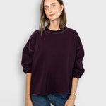 JONES + CO Rachel Comey Fond sweatshirt in plum with drop shoulders, cropped sleeves, and raw edge hemline.