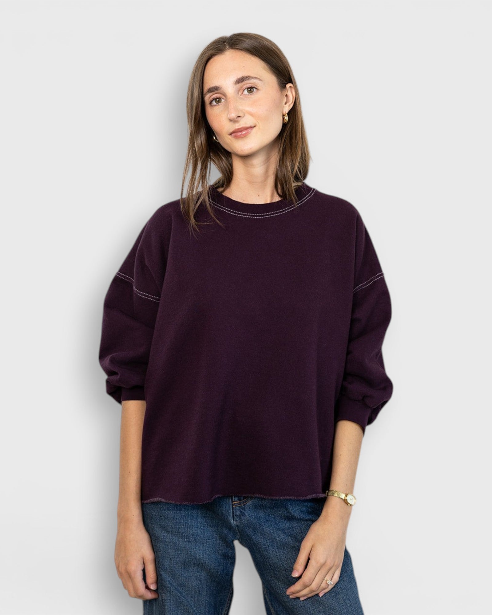 JONES + CO Rachel Comey Fond sweatshirt in plum with drop shoulders, cropped sleeves, and raw edge hemline.