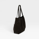 JONES + CO Scallop Tote in dark brown ganache suede with a spacious design and long shoulder straps