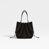 JONES + CO Scallop Tote in rich ganache brown suede with a gathered drawstring design and slim shoulder straps.