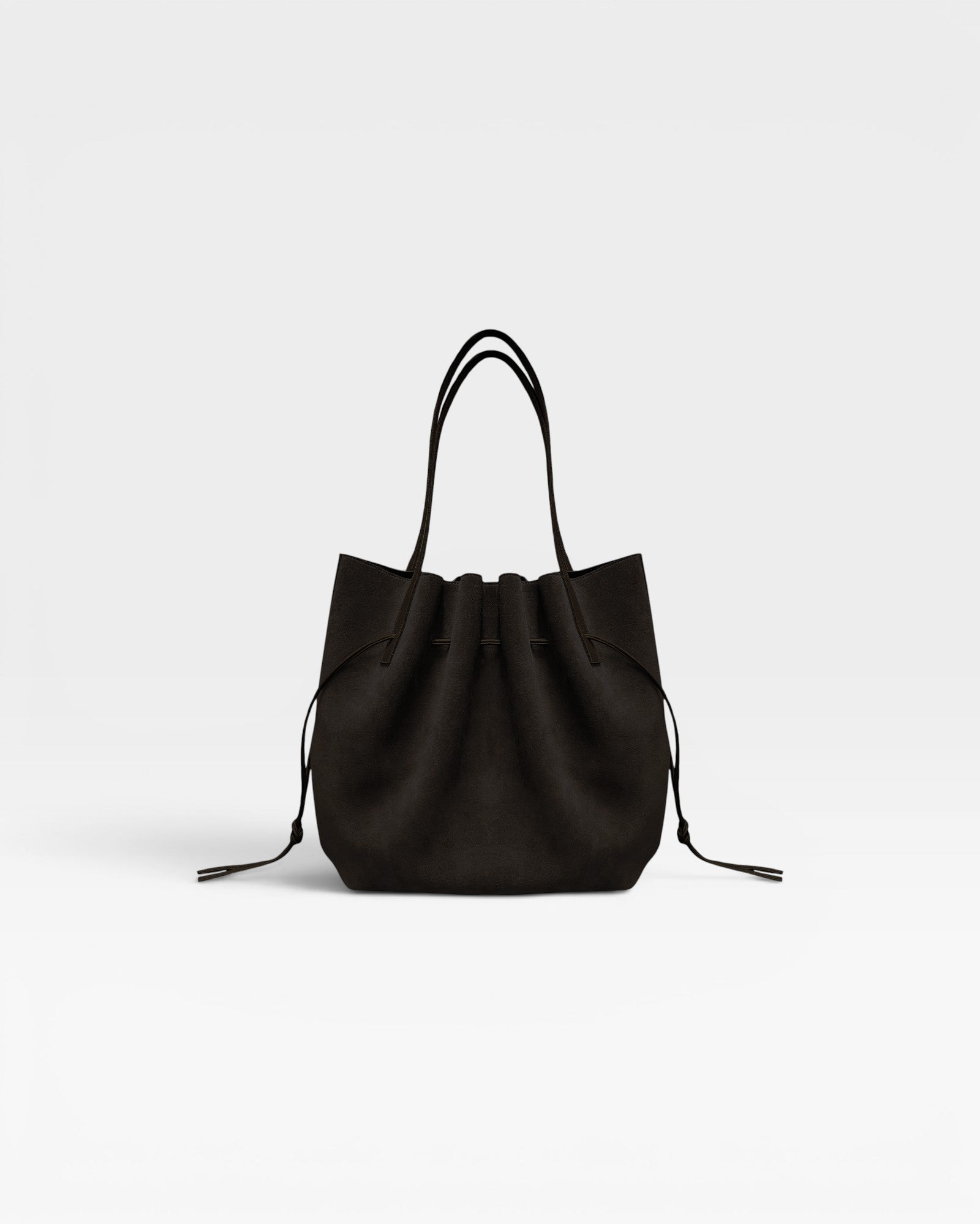 JONES + CO Scallop Tote in rich ganache brown suede with a gathered drawstring design and slim shoulder straps.