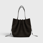 JONES + CO Scallop Tote in rich ganache brown suede with a gathered drawstring design and slim shoulder straps.