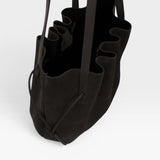 JONES + CO Scallop Tote in rich ganache brown suede with a spacious interior and elegant scalloped edge detail.