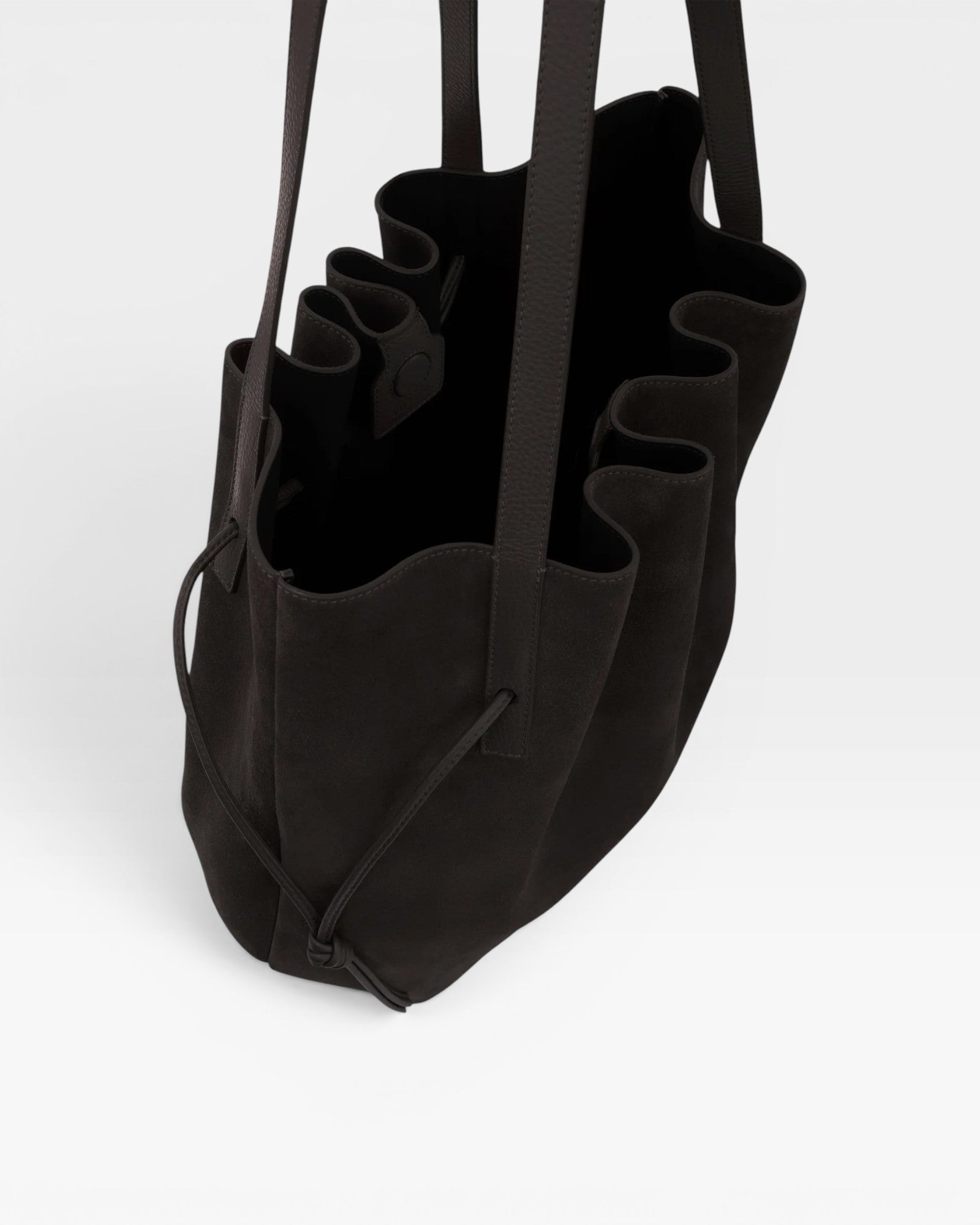 JONES + CO Scallop Tote in rich ganache brown suede with a spacious interior and elegant scalloped edge detail.