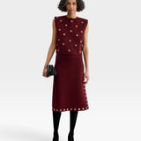 JONES + CO garnet baby alpaca knit vest with metallic eyelet details worn with a matching midi skirt