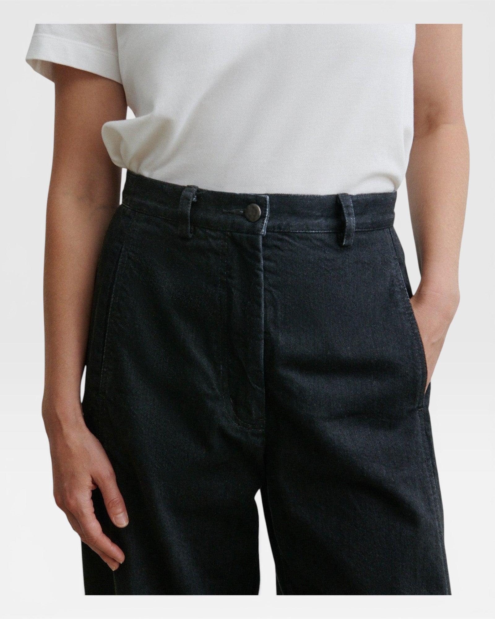 JONES + CO Garra high-waisted black denim jeans with a relaxed wide-leg fit and contrast side panel detail.