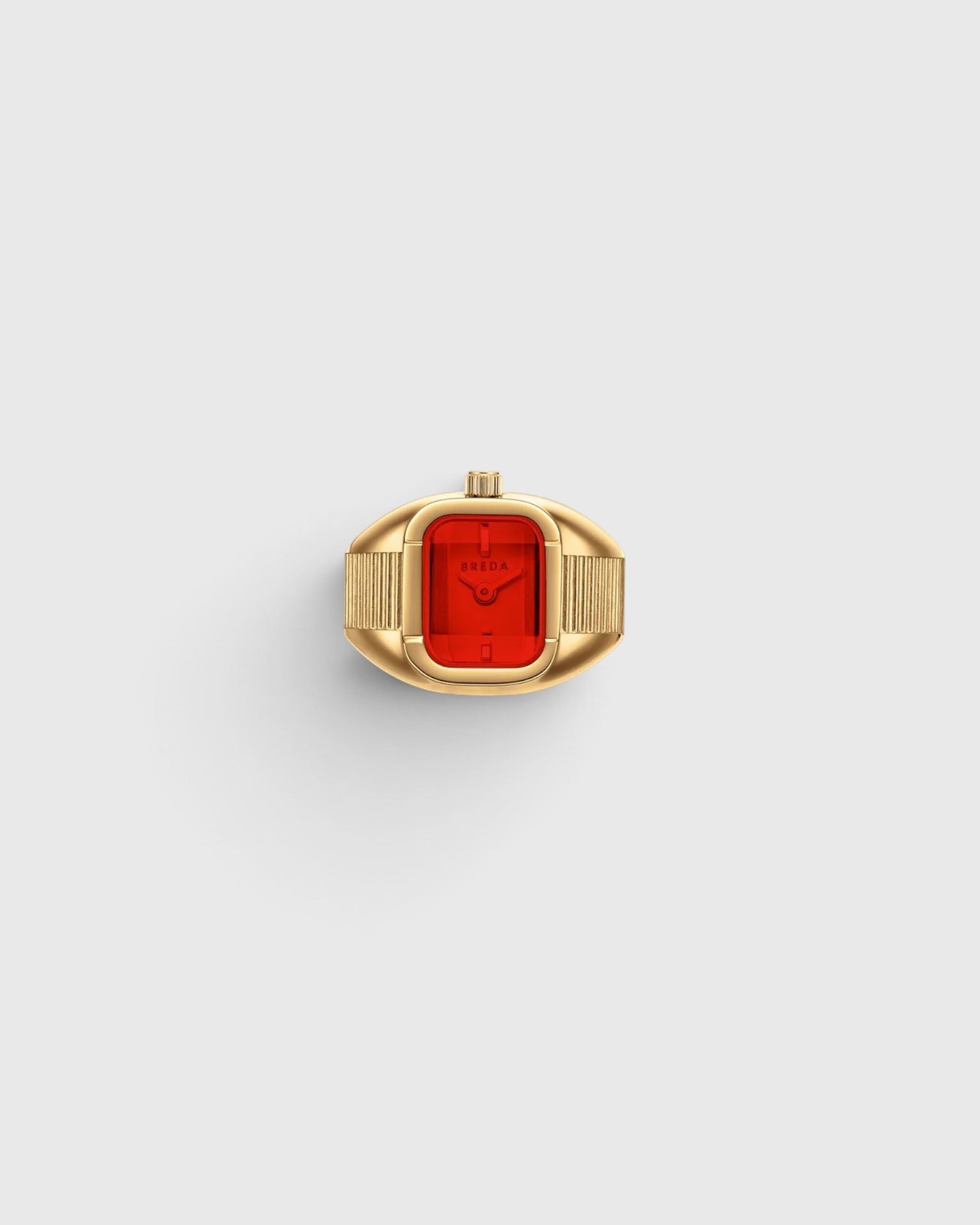 JONES + CO Nocturne Time Ring featuring an 18K deep gold-plated rectangular case and a vibrant flame-colored crystal.