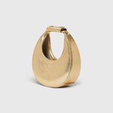 JONES + CO Good Night Moon evening bag in polished gold with a crescent jewel-box silhouette and top handle