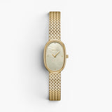 JONES + CO Jane Small watch with an 18mm gold oval case, champagne mother of pearl dial, and woven gold mesh bracelet.