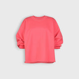 JONES + CO Fond crewneck sweatshirt in guava pink featuring drop shoulders, cropped sleeves, and raw edge hemline.