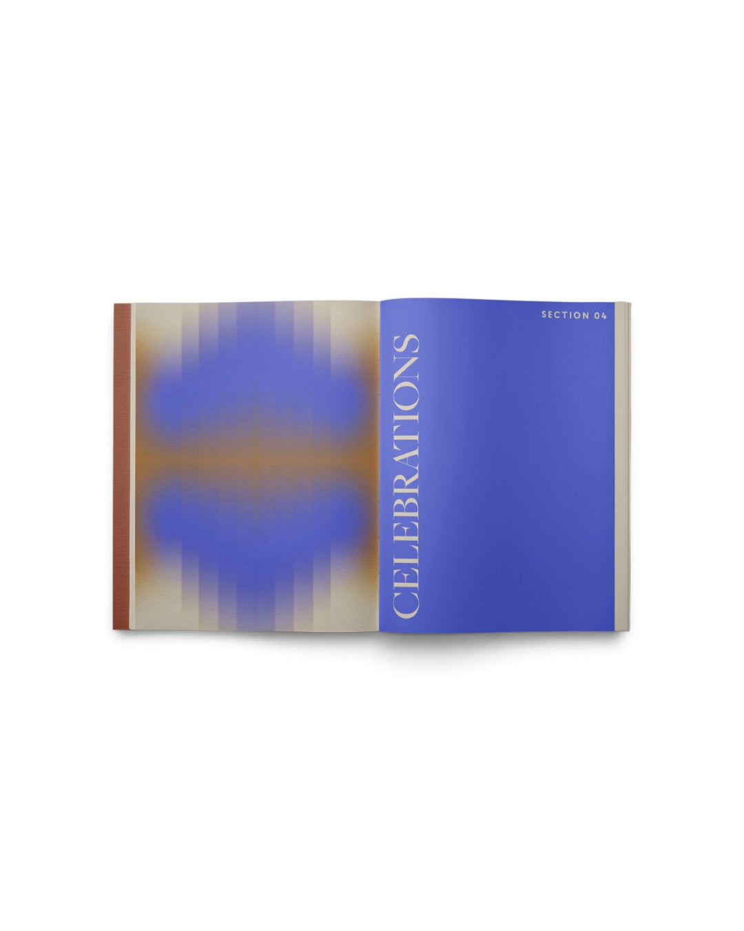 JONES + CO Live Your Vision journal open to the blue Celebrations section with abstract gradient design