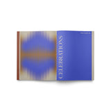 JONES + CO Live Your Vision journal open to the blue Celebrations section with abstract gradient design