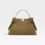 JONES + CO Gyoza pouch in fennel suede with a top handle, brown leather accents, and a silver metal clasp.