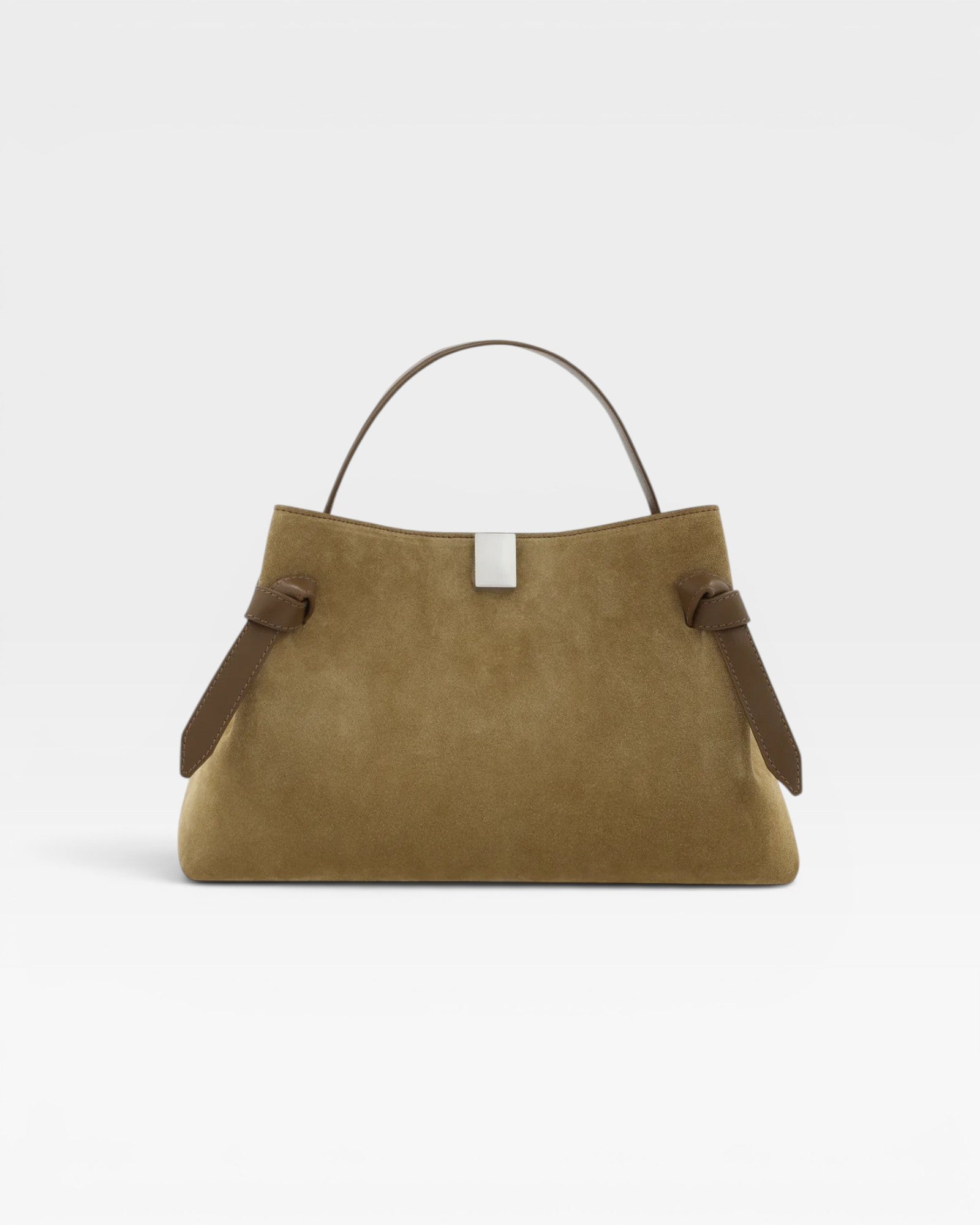 JONES + CO Gyoza pouch in fennel suede with a top handle, brown leather accents, and a silver metal clasp.