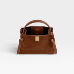 JONES + CO Gyoza Mini handbag in sierra brown embossed Italian leather with gold-tone hardware and top handle.