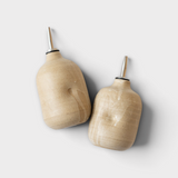 JONES + CO handmade ceramic olive oil cruets with a natural beige glaze and stainless steel pour spouts