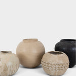 JONES + CO collection of four unique handthrown ceramic vases in neutral and black tones with textured finishes