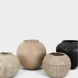 JONES + CO collection of four unique handthrown ceramic vases in neutral and black tones with textured finishes