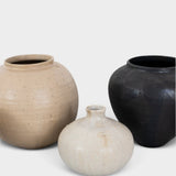 JONES + CO handthrown ceramic vases in beige, cream, and matte black with unique organic shapes