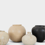 JONES + CO handthrown ceramic vases in various neutral and black tones with unique sculptural shapes