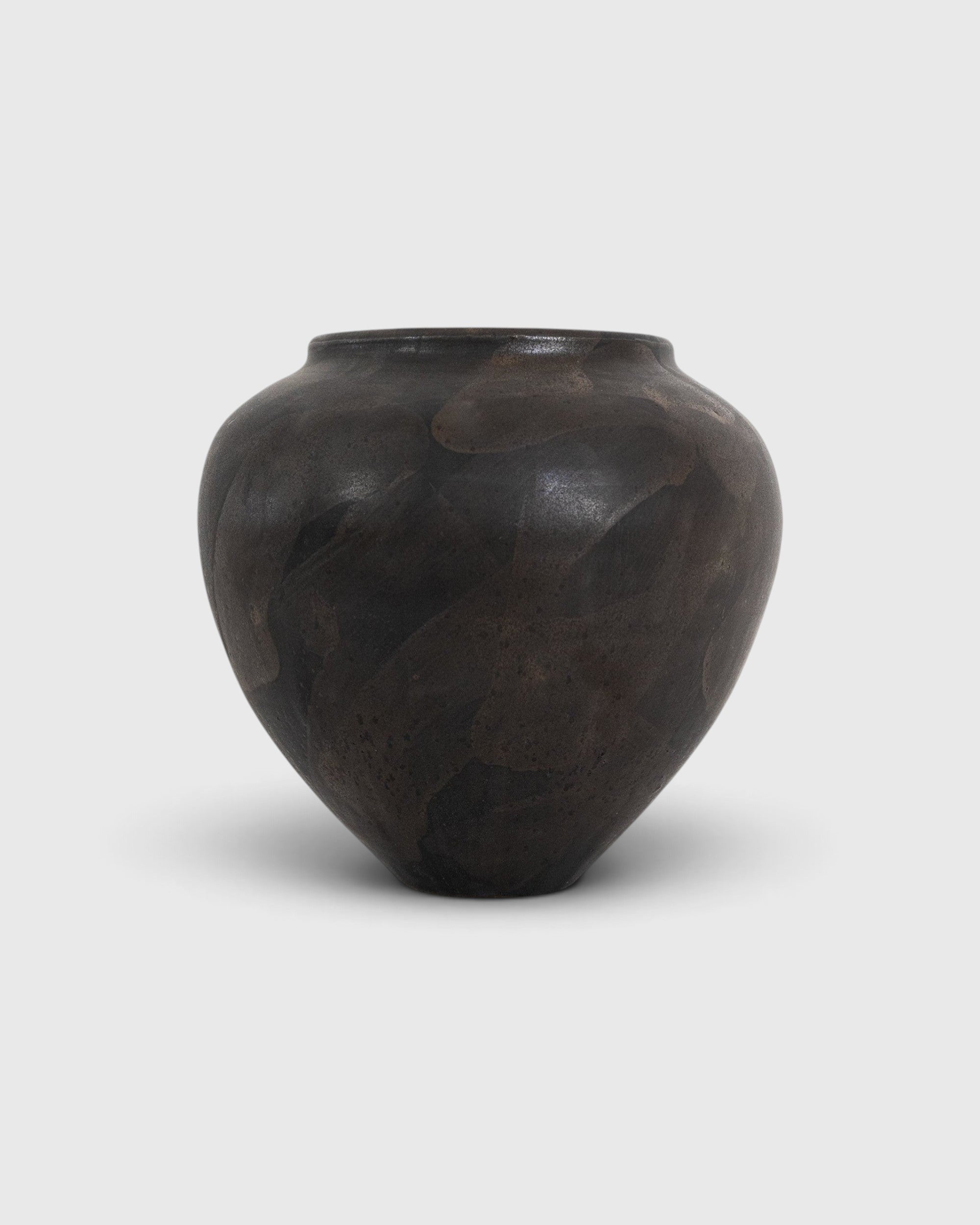 JONES + CO handthrown ceramic Vase No. 1 in a dark, mottled charcoal finish with a unique sculptural silhouette.