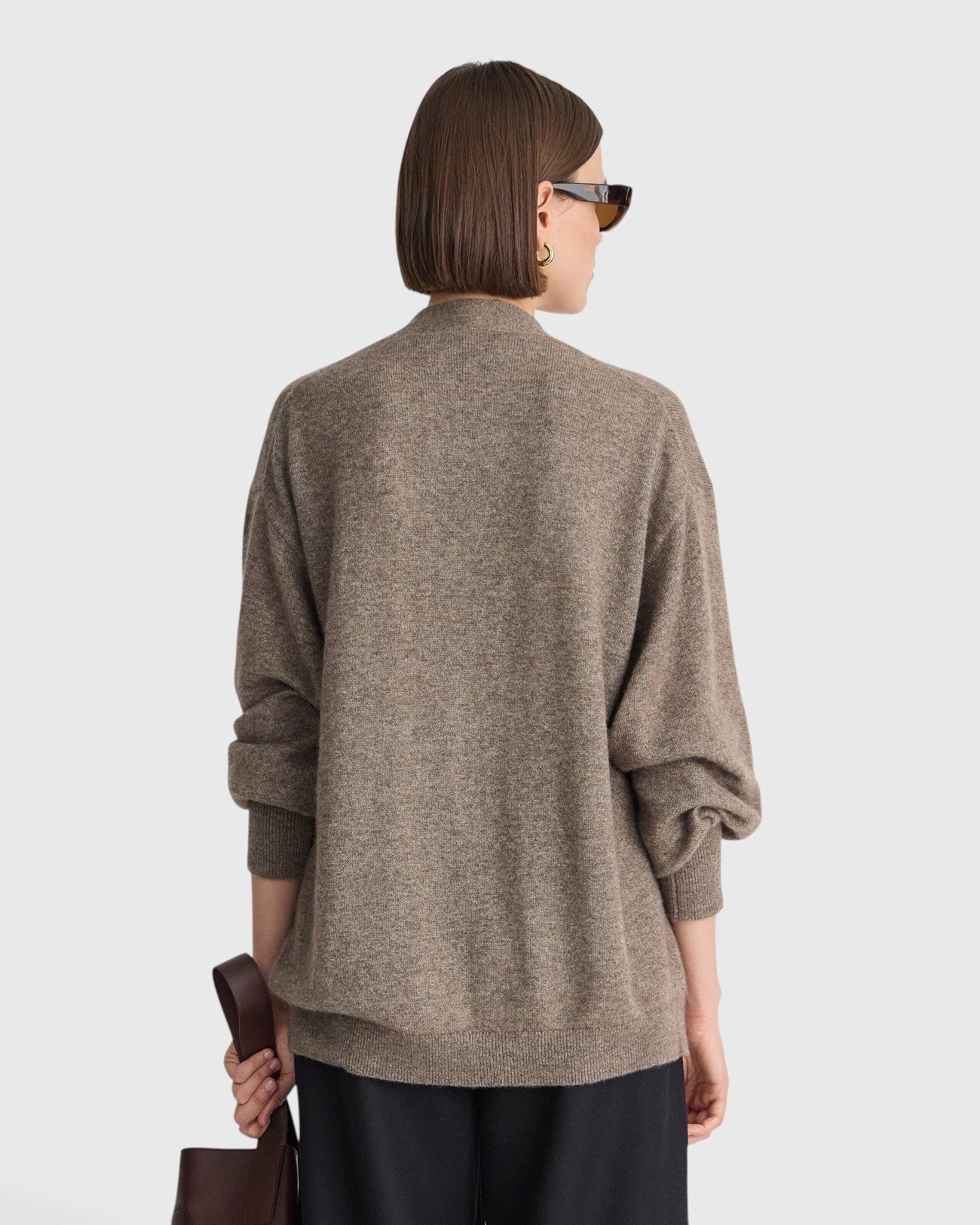 JONES + CO hazelnut cashmere-silk cardigan with drop shoulders and ribbed trim, viewed from the back on a model