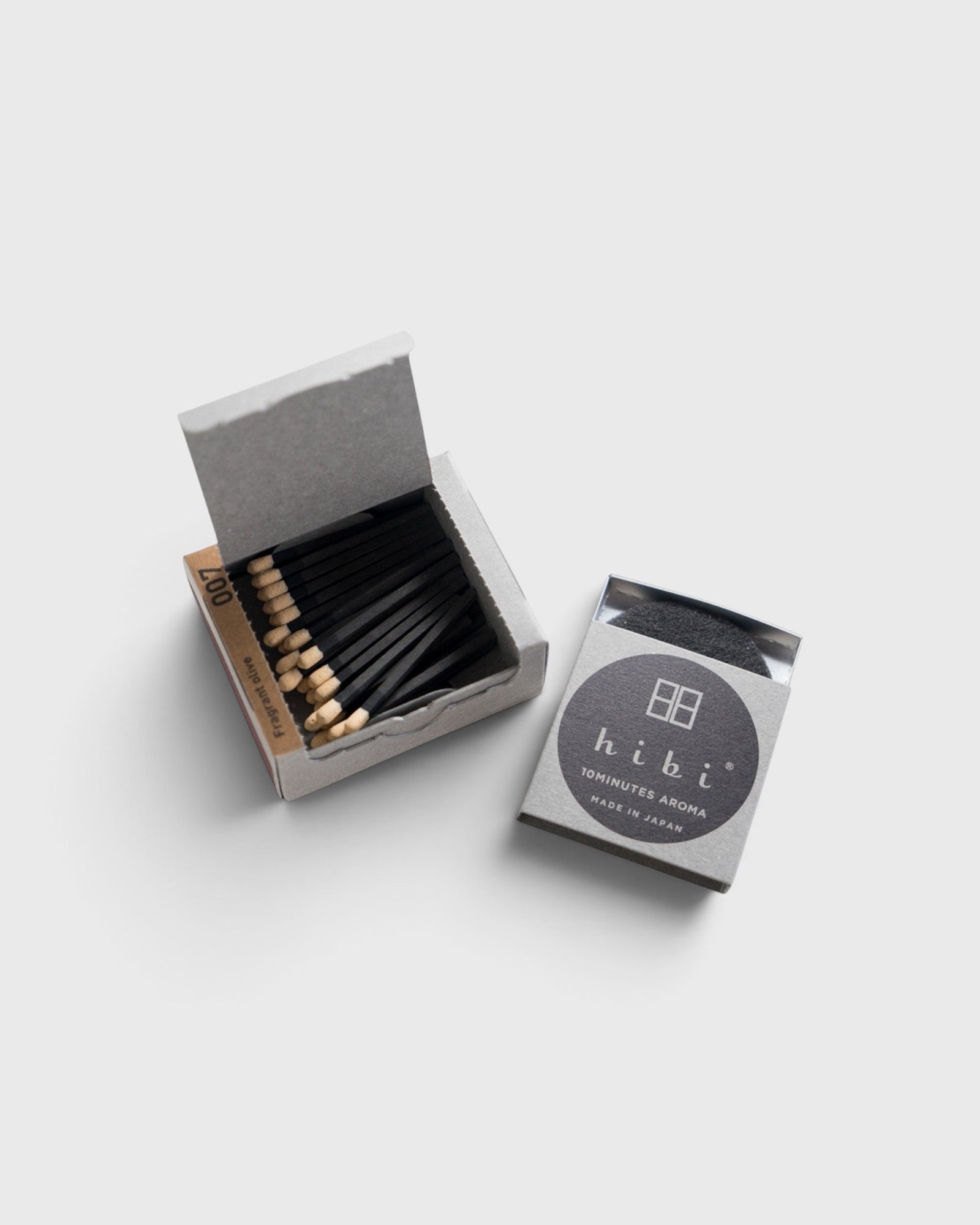 JONES + CO Hibi sandalwood incense matches in a grey box with black matchsticks, providing a 10-minute aroma.