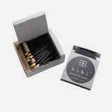 JONES + CO Hibi incense matches in sandalwood, featuring a grey box of 30 black sticks with light wooden tips.