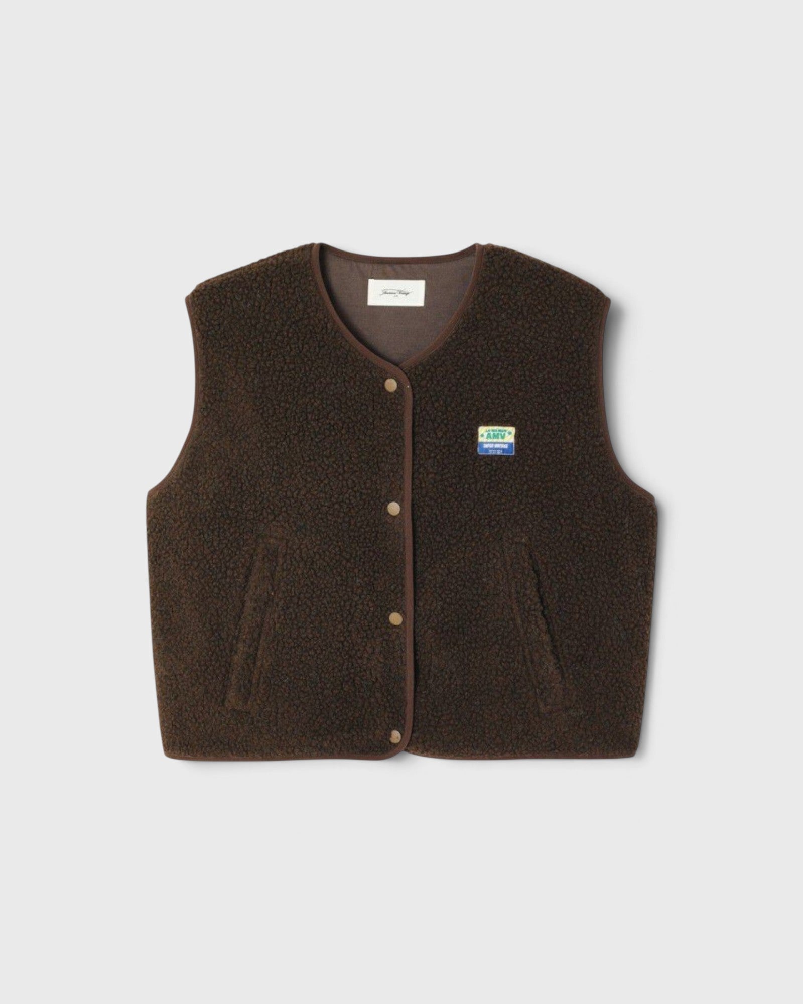 JONES + CO Hoktown sleeveless shearling jacket in chestnut tree melange brown with snap button closure