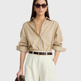 JONES + CO  apiece apart Isolde button-down shirt in sand and blue stripe with dropped shoulders and a structured collar.