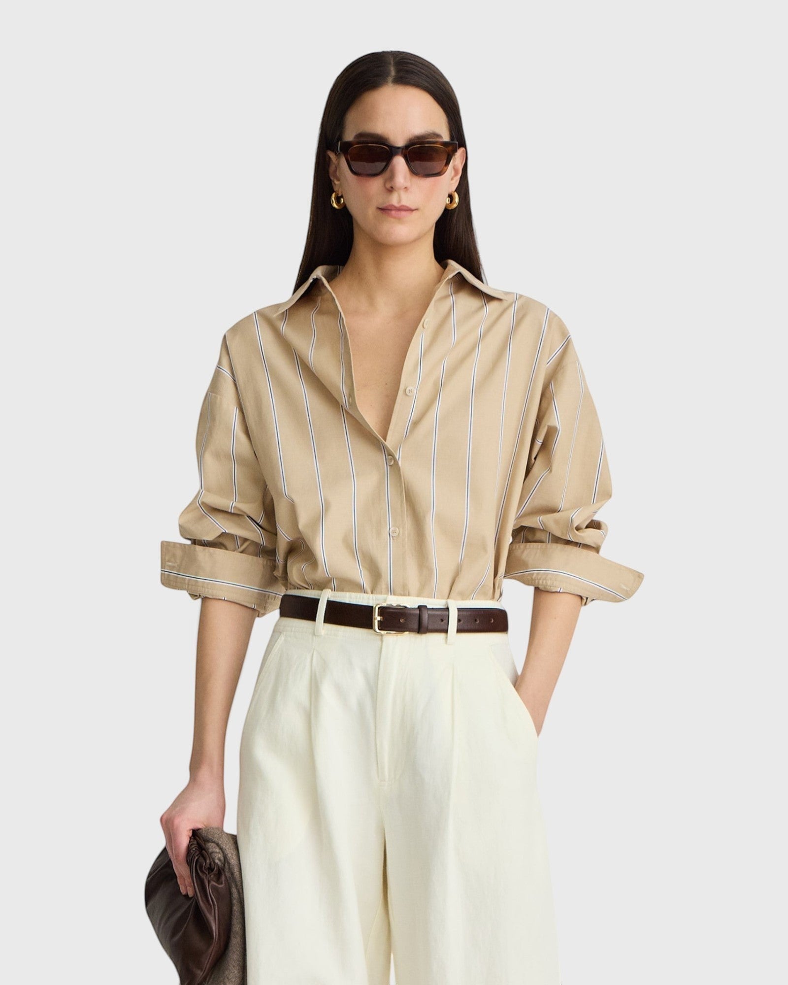 JONES + CO  apiece apart Isolde button-down shirt in sand and blue stripe with dropped shoulders and a structured collar.