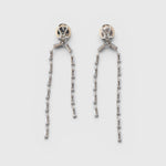 JONES + CO Rachel Comey ivory acrylic and brass baguette drop earrings with surgical steel posts.
