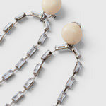 JONES + CO Rachel Comey ivory acrylic and baguette crystal drop earrings with nickel-free brass and steel posts.