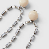 JONES + CO Rachel Comey ivory acrylic and baguette crystal drop earrings with nickel-free brass and steel posts.