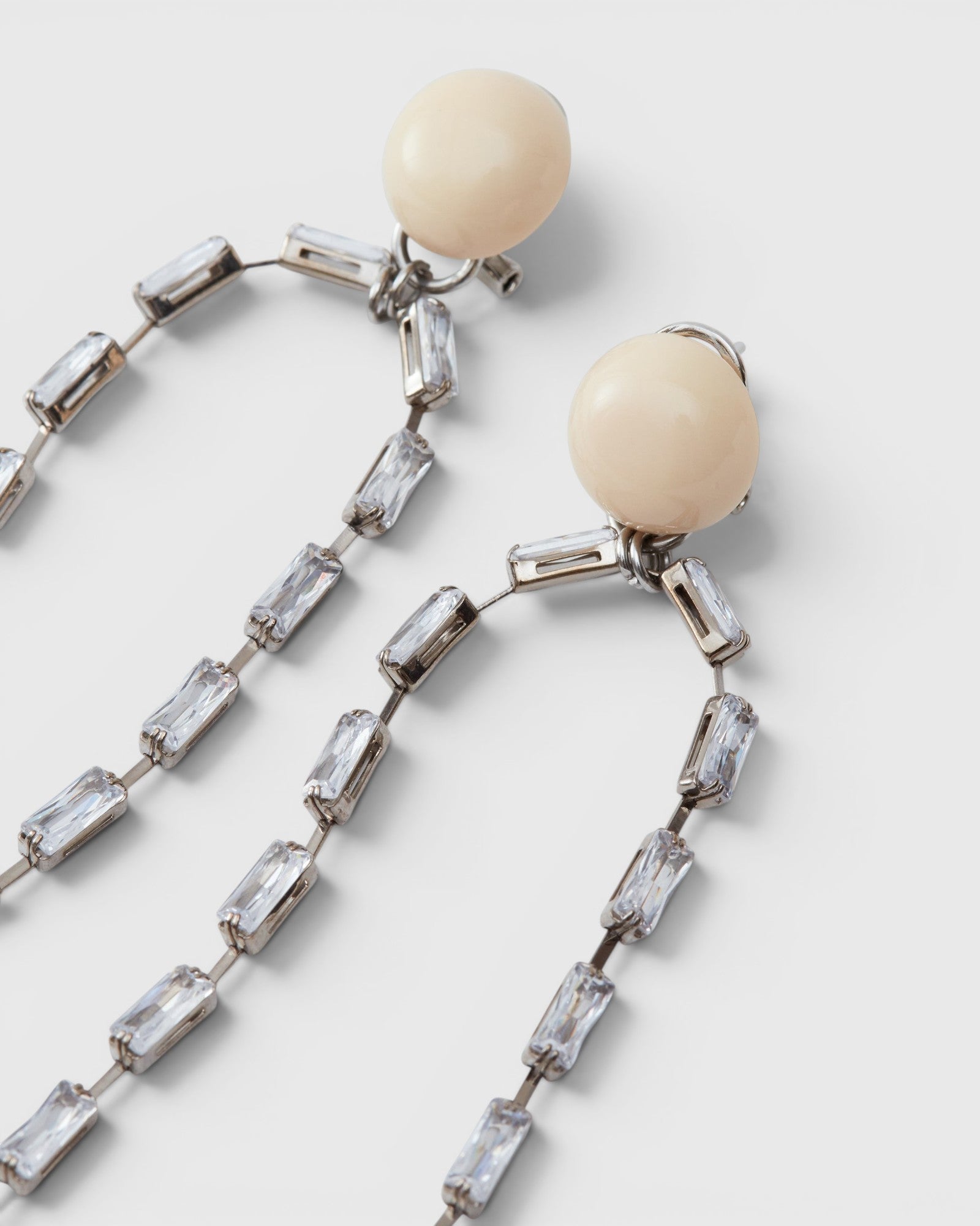 JONES + CO Rachel Comey ivory acrylic and baguette crystal drop earrings with nickel-free brass and steel posts.