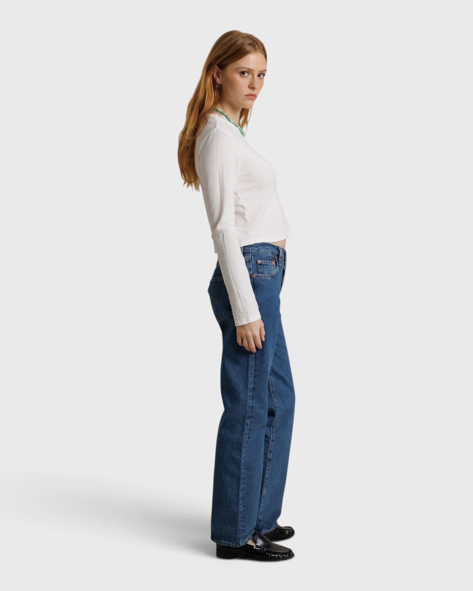 JONES + CO Jamie long sleeve tee in whitecap grey recycled cotton worn by a model with blue jeans and loafers