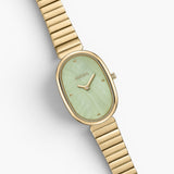 JONES + CO Jane watch with a gold-plated oval case, mint green dial, and matching gold stainless steel bracelet.