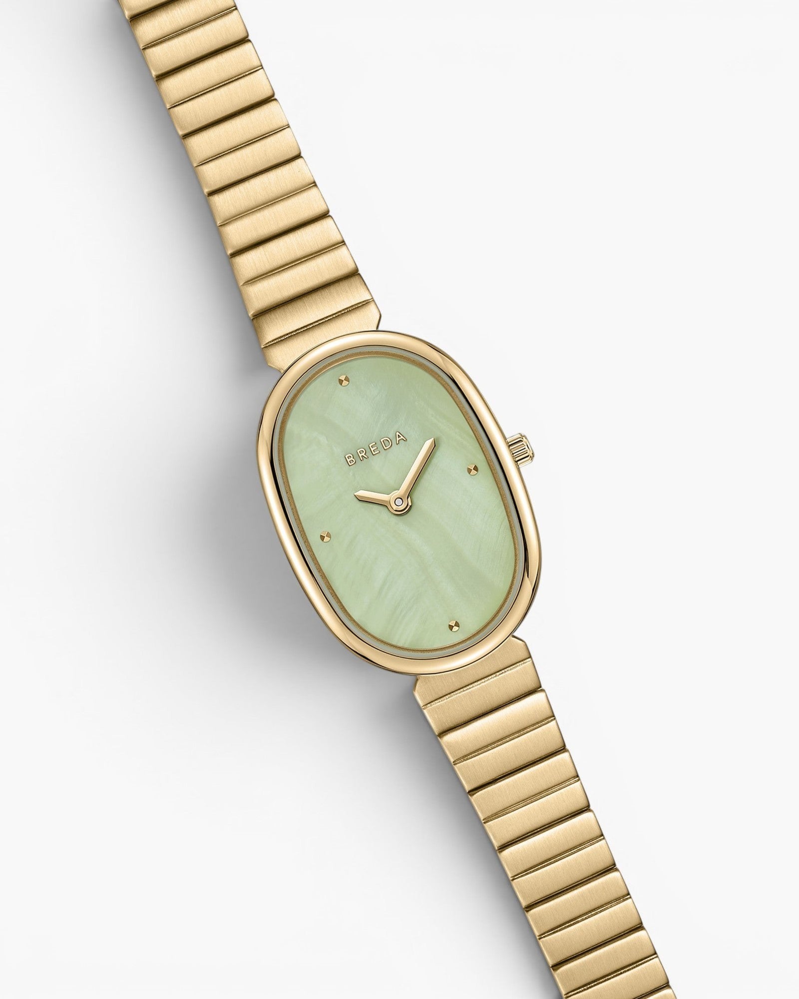 JONES + CO Jane watch with a gold-plated oval case, mint green dial, and matching gold stainless steel bracelet.