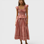 JONES + CO Janne top in terra rosso check with square neckline, frilled cap sleeves, and shirred waist on a model