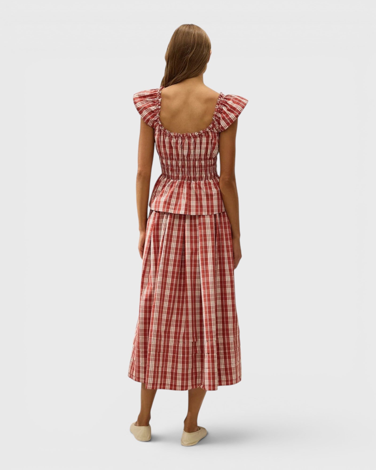 JONES + CO Janne top in terra rosso check print with square neckline, cap sleeves, and shirred waist, back view.