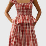 JONES + CO Janne top in terra rosso check with square neckline, cap sleeves, and shirred waist on a model