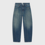 JONES + CO Jazzie barrel jeans in dark blue denim with a mid-rise waist and cropped leg silhouette.