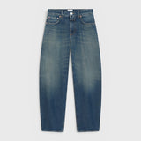 JONES + CO Jazzie barrel jeans in dark blue denim with a mid-rise waist and cropped leg silhouette.