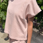 JONES + CO Jeanne muscle tee in baby pink with a high crew neck, wide neckband, and dolman sleeves.