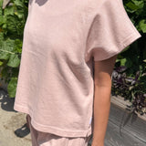 JONES + CO Jeanne muscle tee in baby pink with a high crew neck, wide neckband, and dolman sleeves.