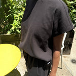 JONES + CO Jeanne muscle tee in dark slate with a high crew neck and dolman sleeves worn outdoors.