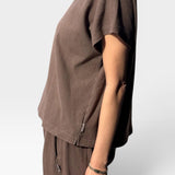 JONES + CO Jeanne muscle tee in chocolate brown with dolman sleeves and a cropped fit, side view on a model.