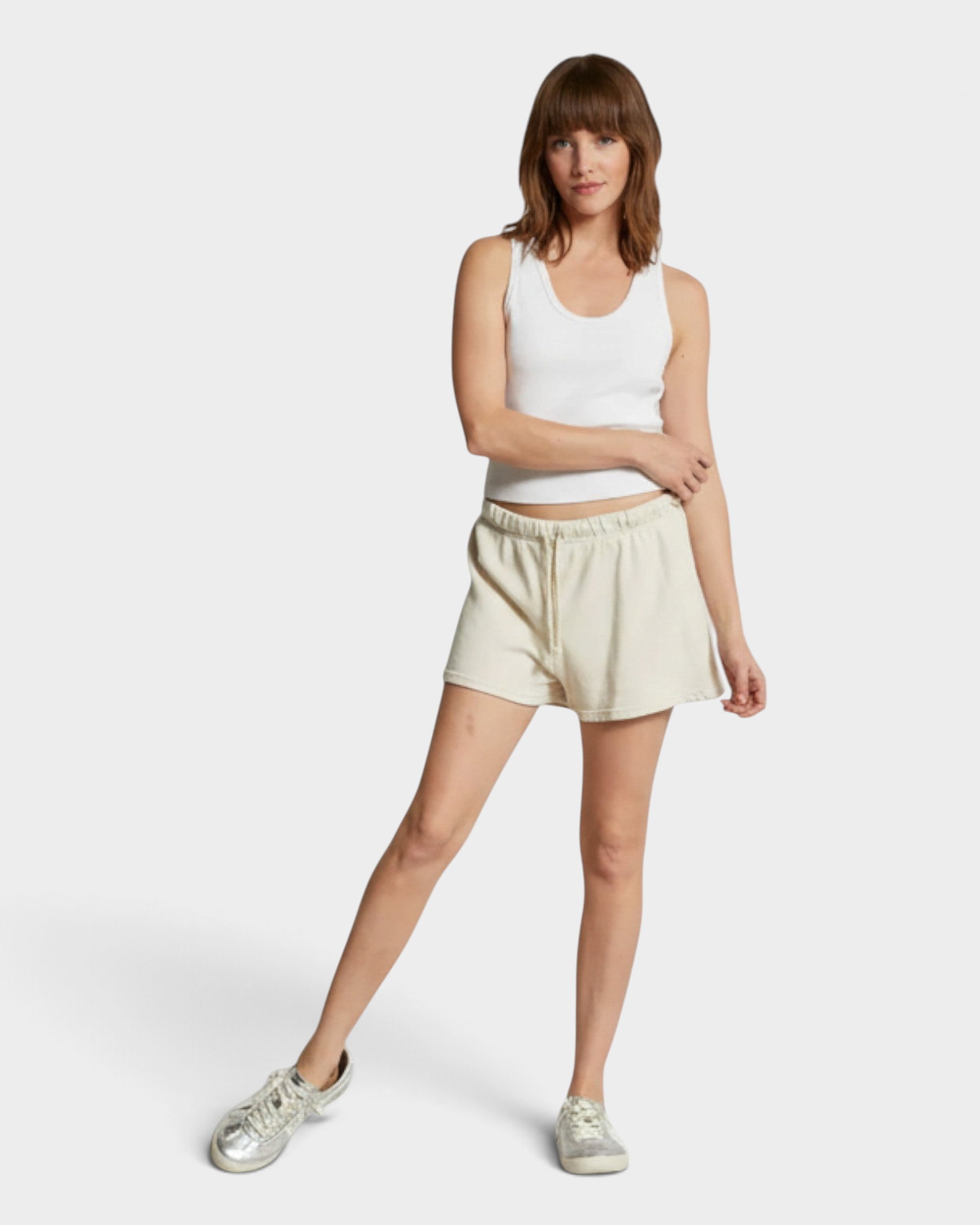 JONES + CO Layla French Terry sweat shorts in sugar beige with an elastic waistband and raw edge hem on a model.